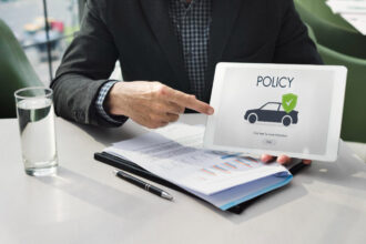 How do the make and model of a car impact the policy premium?