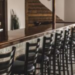 Why Natural Plywood Prouve Restaurant Chairs Are Taking the Hospitality Industry by Storm