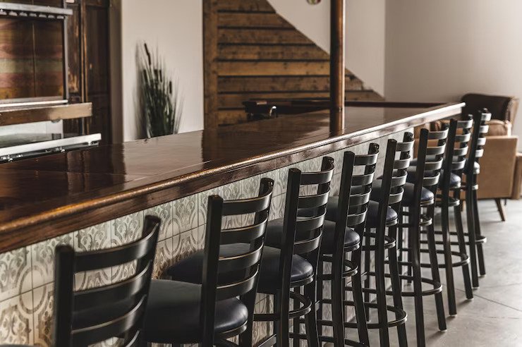 Why Natural Plywood Prouve Restaurant Chairs Are Taking the Hospitality Industry by Storm